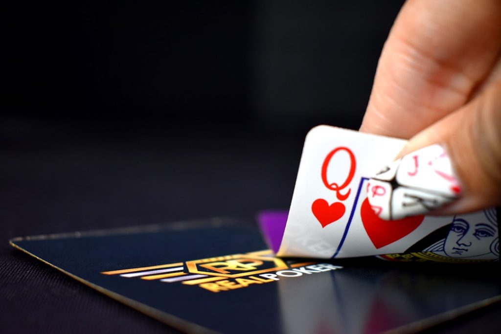 selective focus photography of queen of hearts playing card