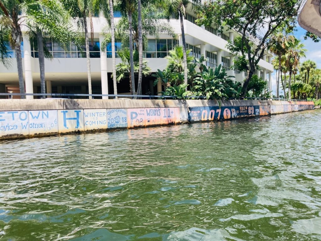 a body of water with a building in the background