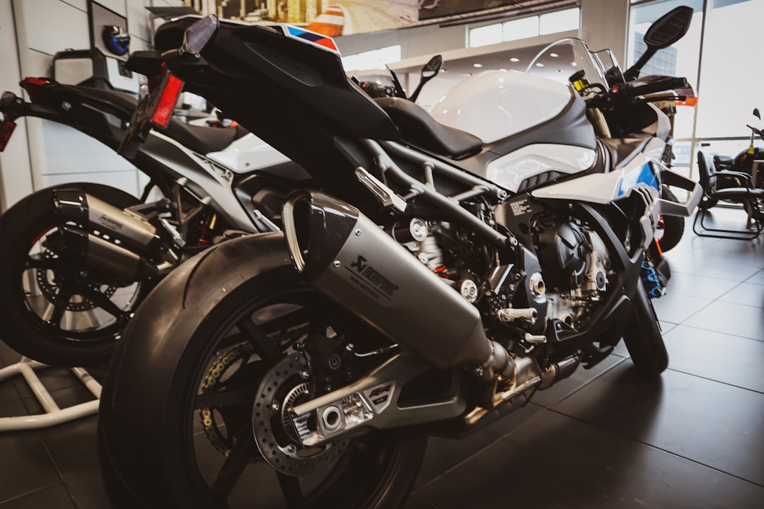 White and black sport motorcycle parked indoors