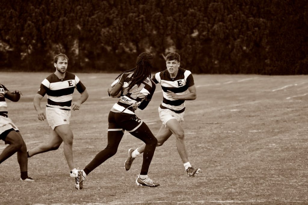 A group of young men playing a game of frisbee