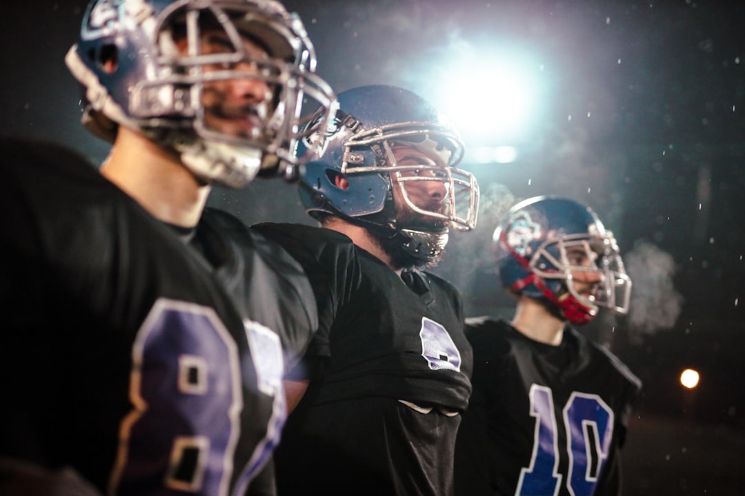 a group of football players standing next to each other