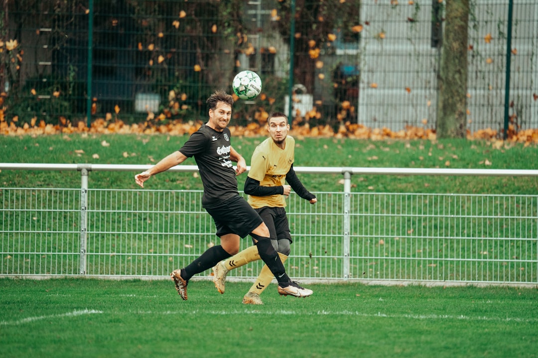 a couple of men playing a game of soccer