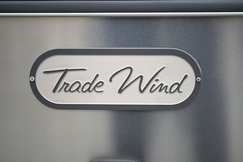 A close up of a metal sign on a wall