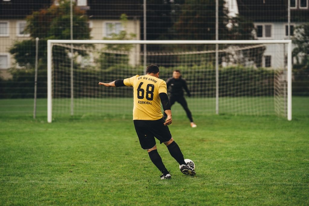 a person kicking a football ball