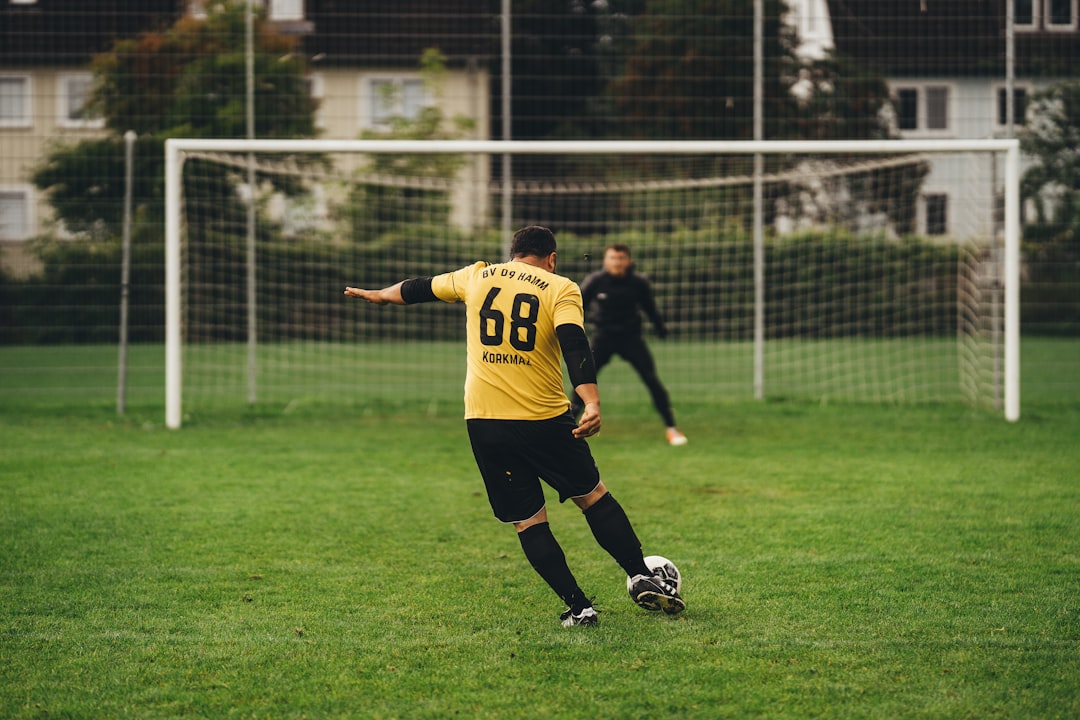 a person kicking a football ball