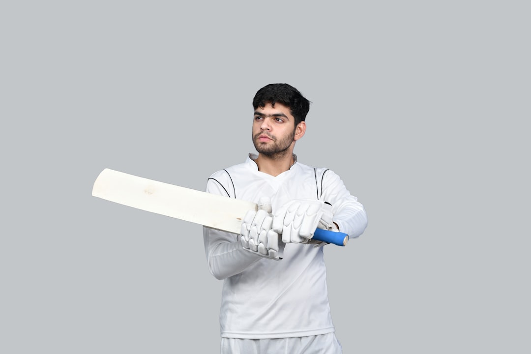 a man holding a white sword