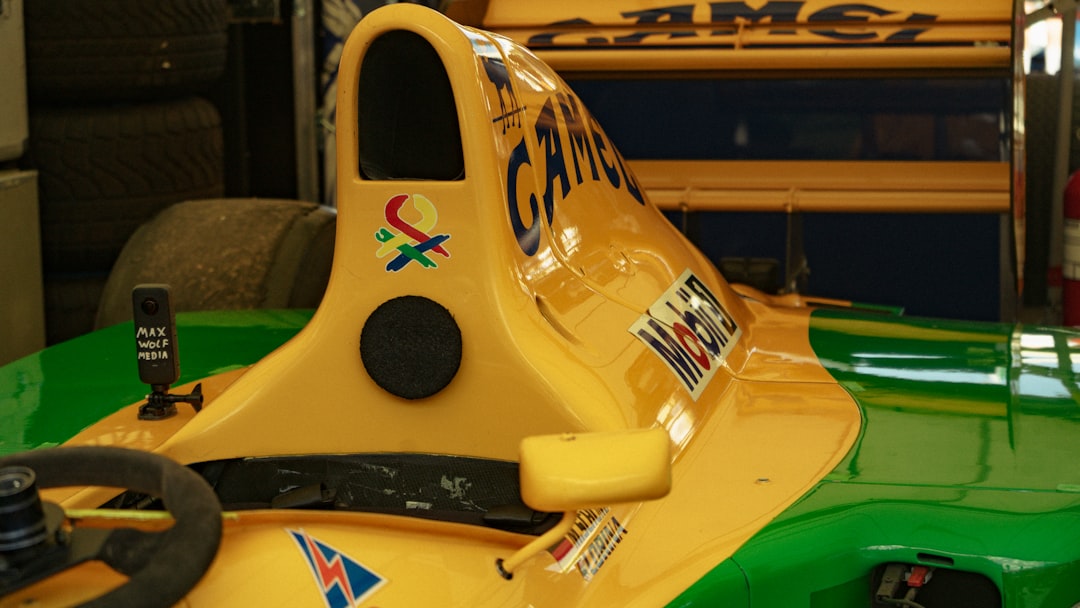 Yellow and green racing car with camel logos
