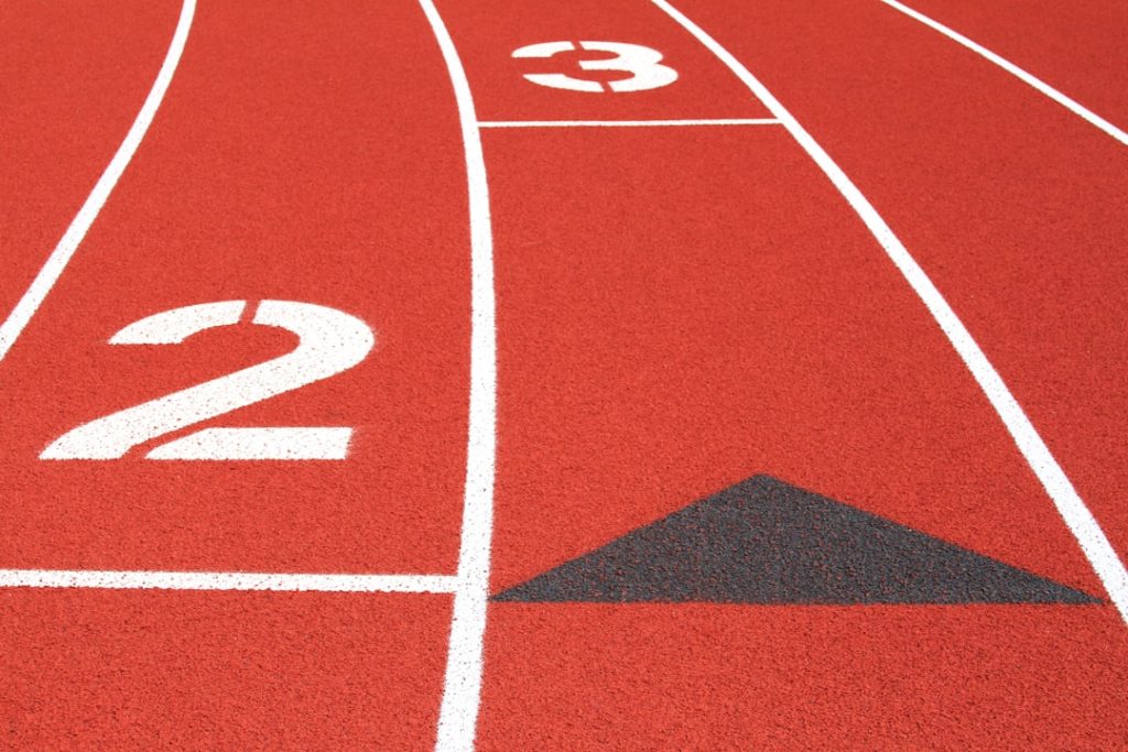 a close up of a running track with numbers on it
