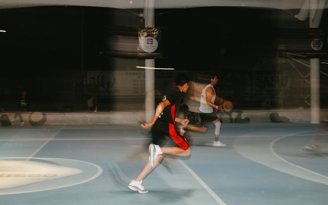 A group of people playing a game of tennis