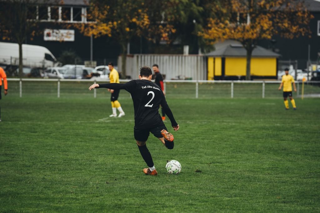 A group of young men playing a game of soccer