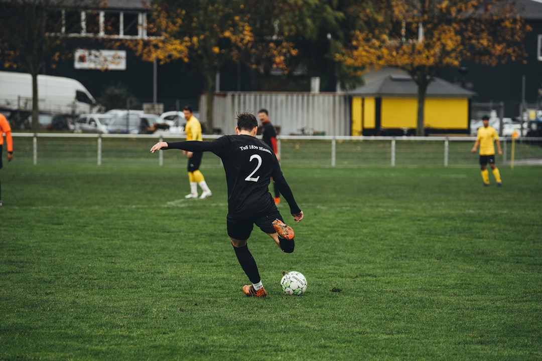 A group of young men playing a game of soccer