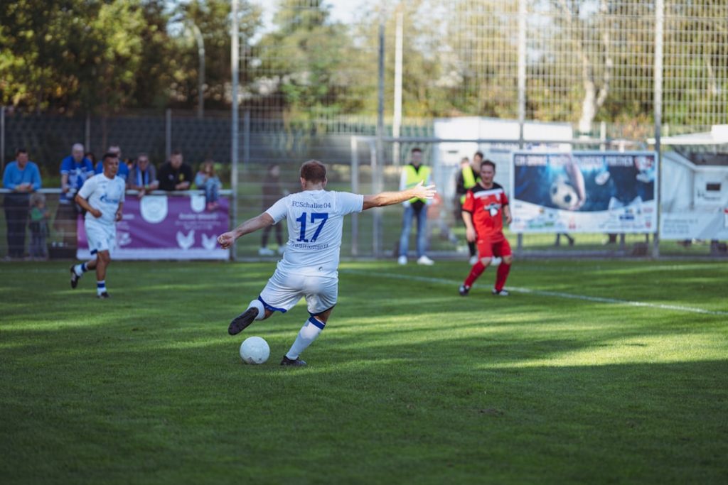 a football player kicking a ball