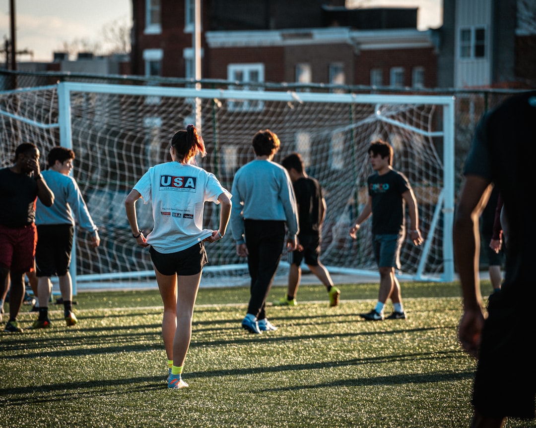 a group of people playing soccer on a field