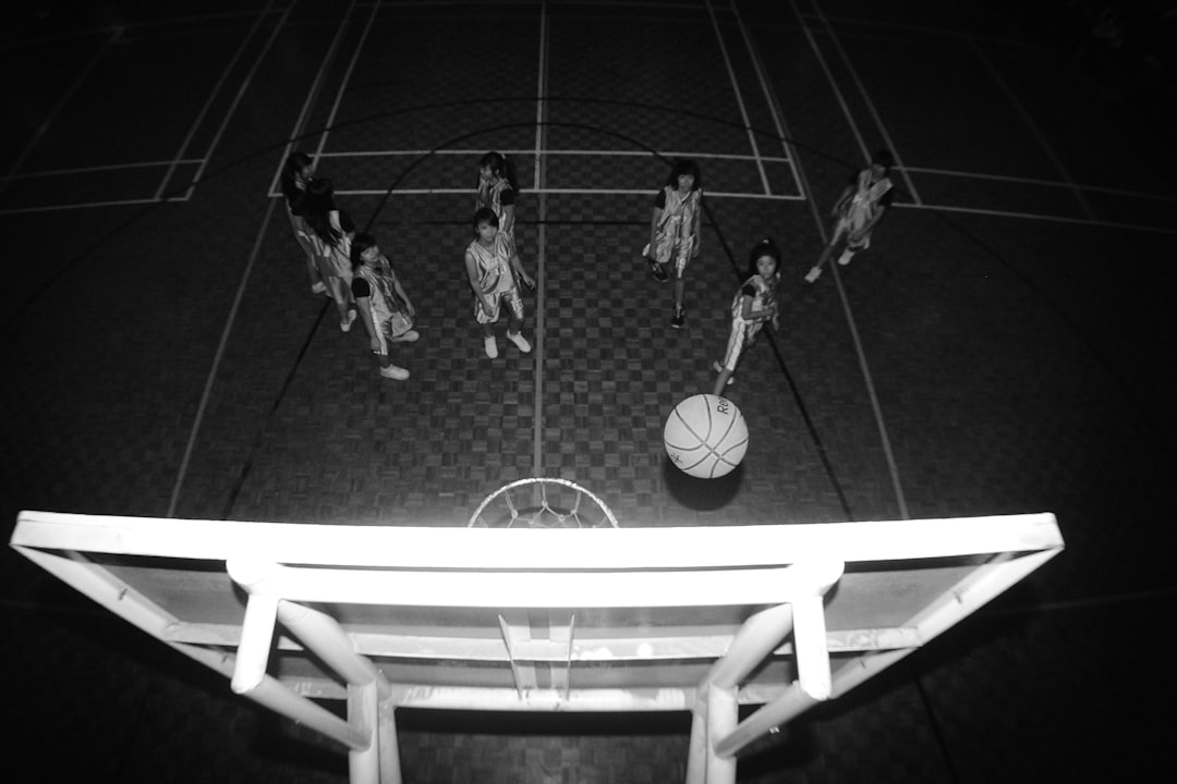 a group of women playing basketball