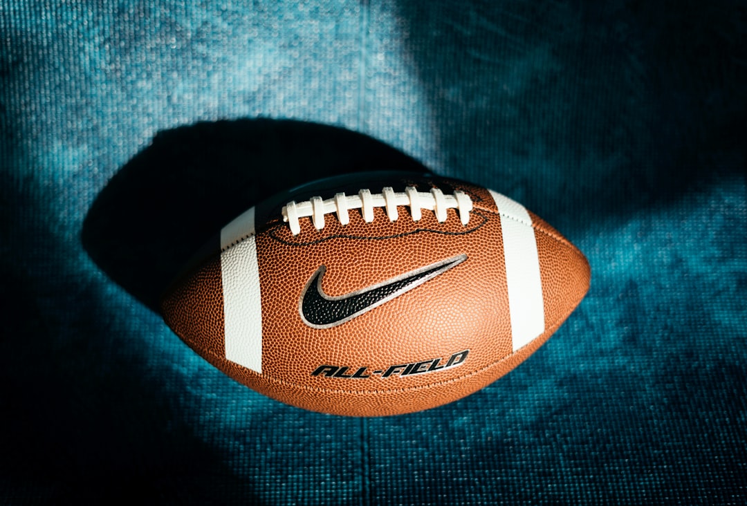 a close up of a football on a blue background
