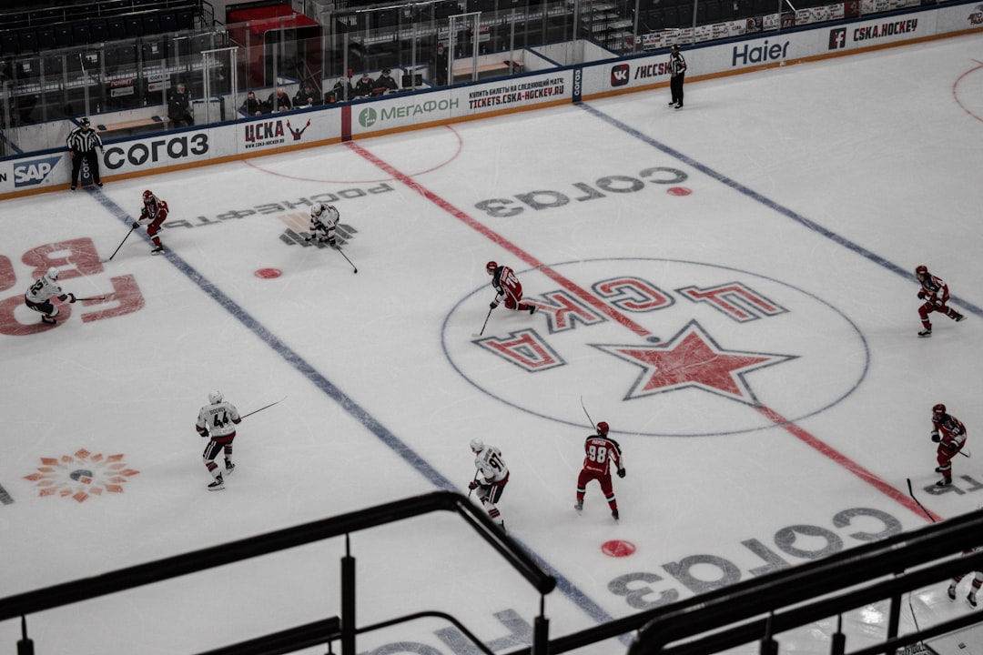 people playing ice hockey on ice hockey field