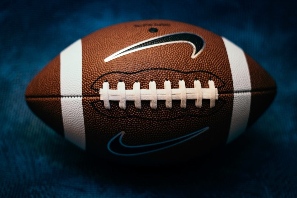 a close up of a football on a blue background