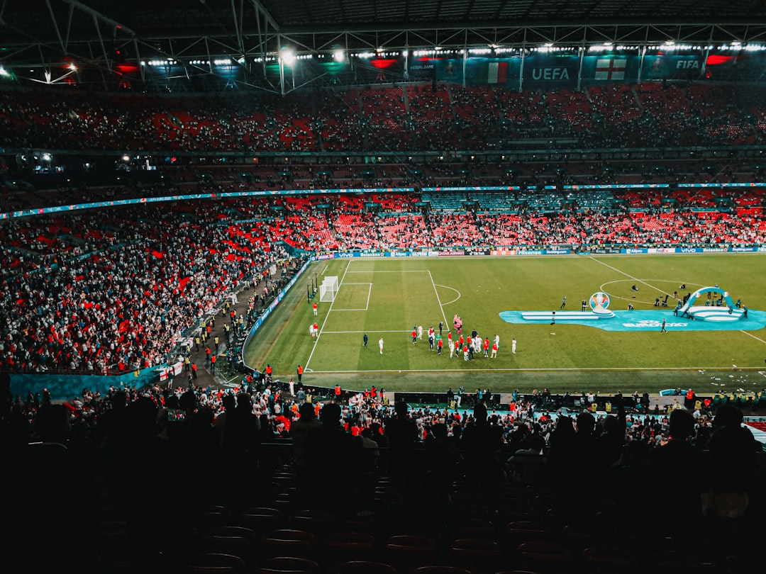 people watching football game on stadium