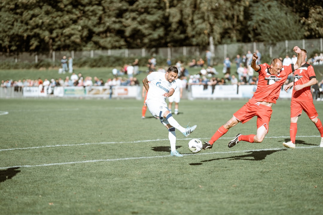 a group of young men playing a game of soccer