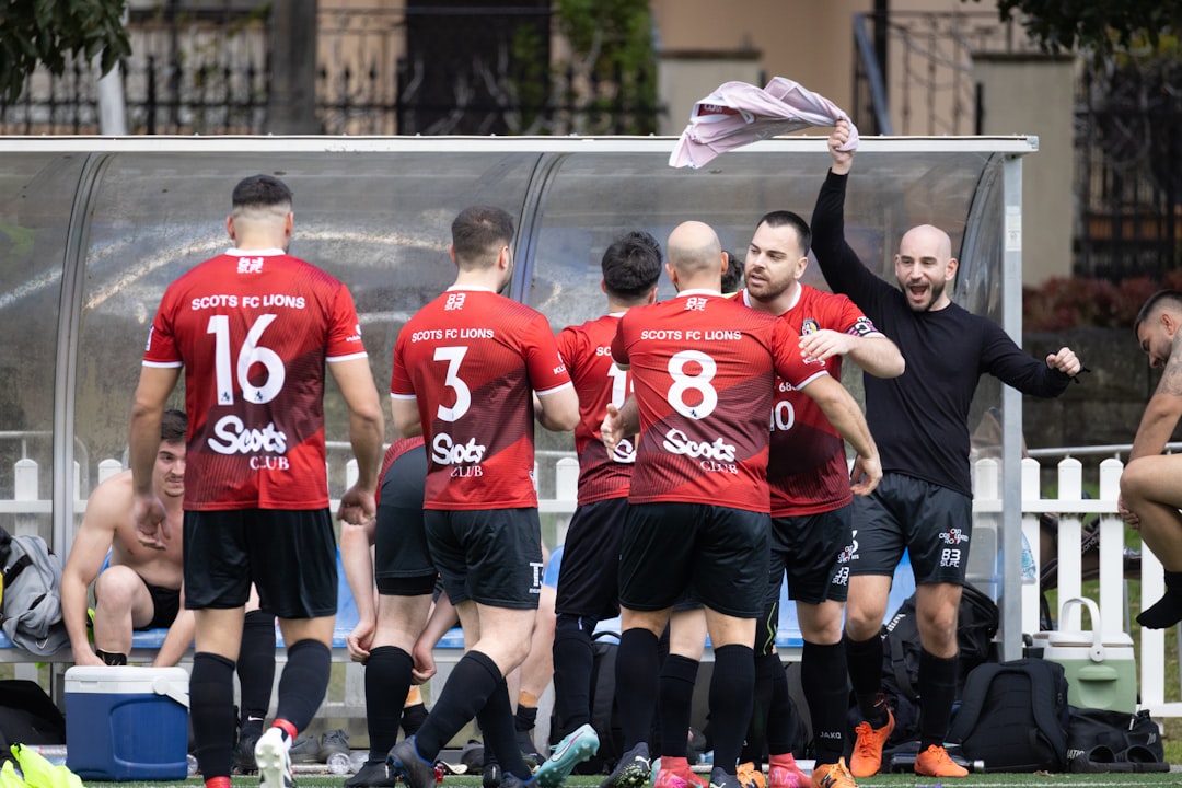 Football players celebrating a victory on the field.