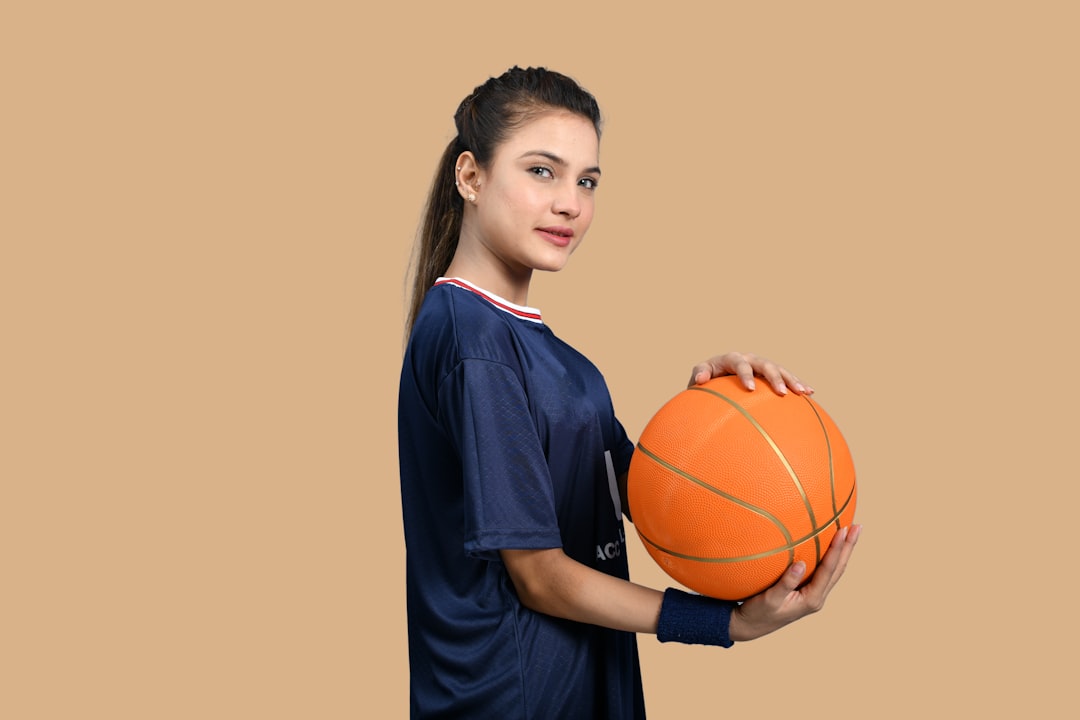 a man holding a basketball