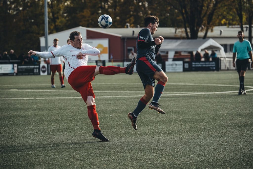 a couple of men playing a game of soccer