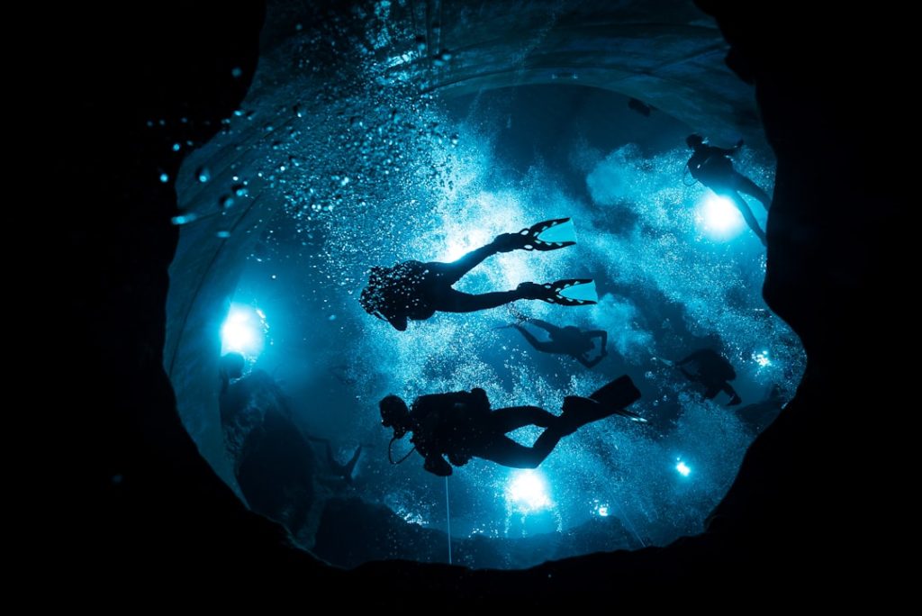 A group of people swimming in the water
