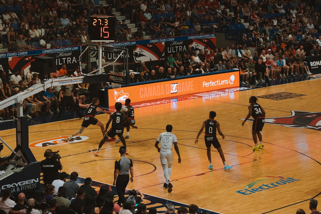 Basketball players compete on the court during a game.