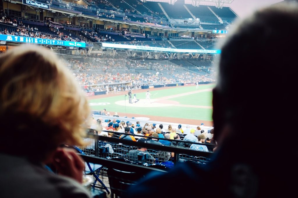 people watching on stadium during daytime
