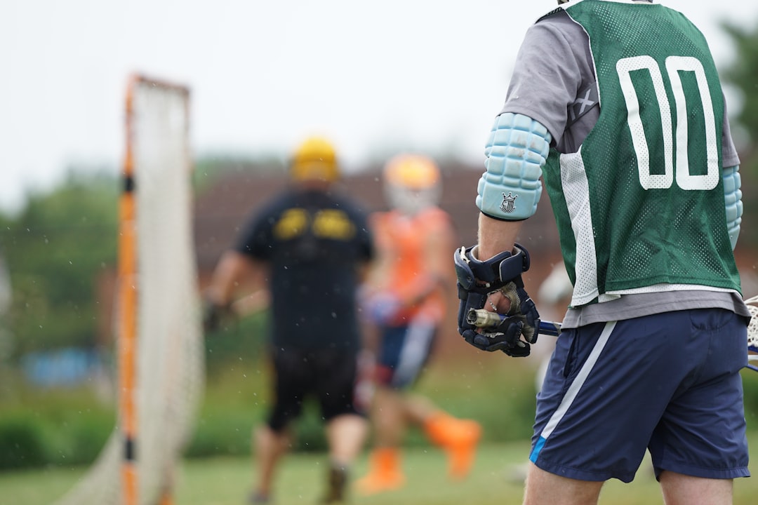 people playing lacrosse game