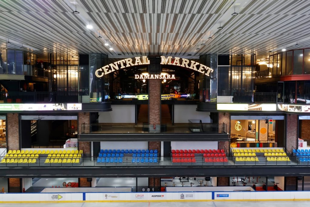 Central market building interior with shops and seating