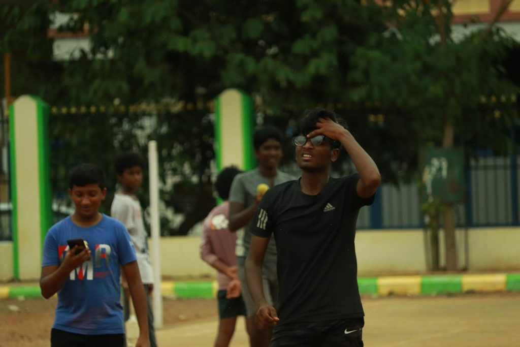 a group of young men playing a game of frisbee
