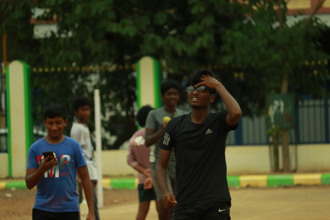 a group of young men playing a game of frisbee