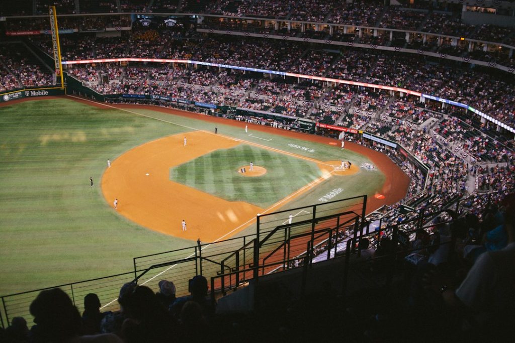 A baseball stadium at night with a game in progress
