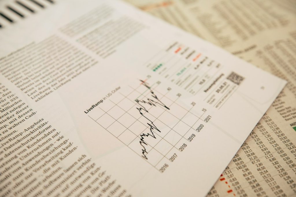 financial newspaper with stock chart