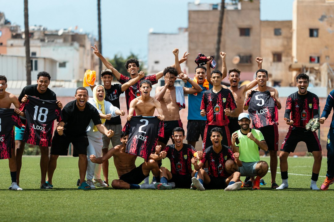 Soccer team celebrates a victory on the field