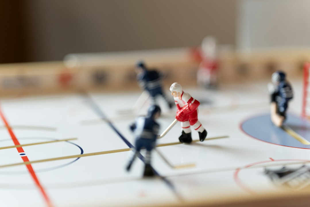 Hockey game with miniature players in action