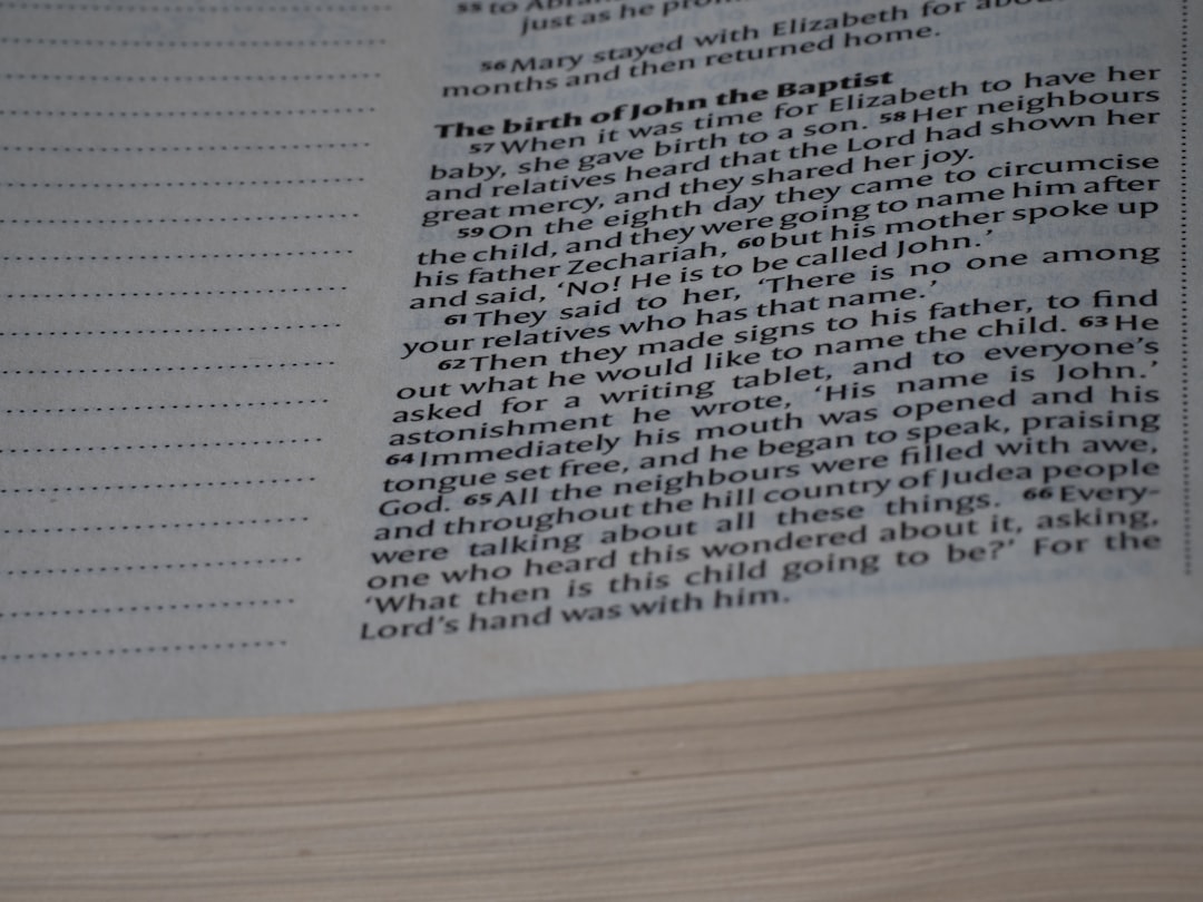 A close up of an open book with text on it