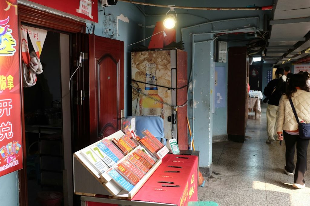 Street stall with books and people walking