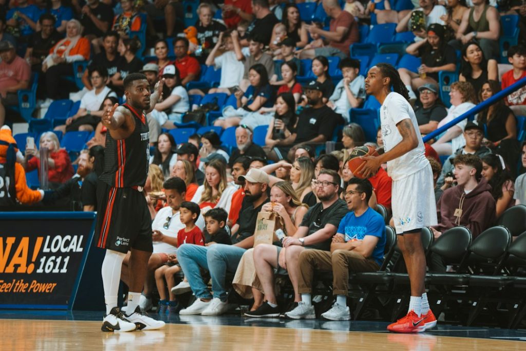 Basketball players on a court are in action
