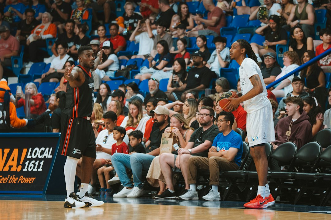 Basketball players on a court are in action