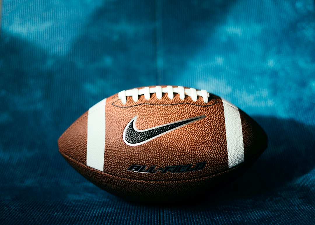 a close up of a football on a blue background