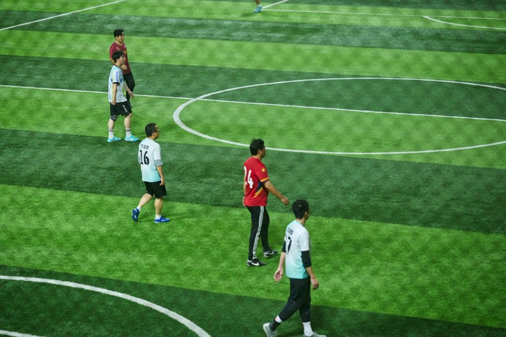 Soccer players on a green field during a game